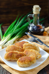 Chicken patties or fish cakes fried in breadcrumbs