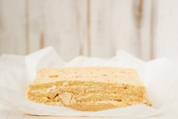 A whole napoleon cake. Vegetarian homemade cake on a white background.