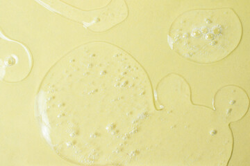 Background from cosmetic gel drops with bubbles.Top view,antibacterial liquid surface.Good as background or mockup.