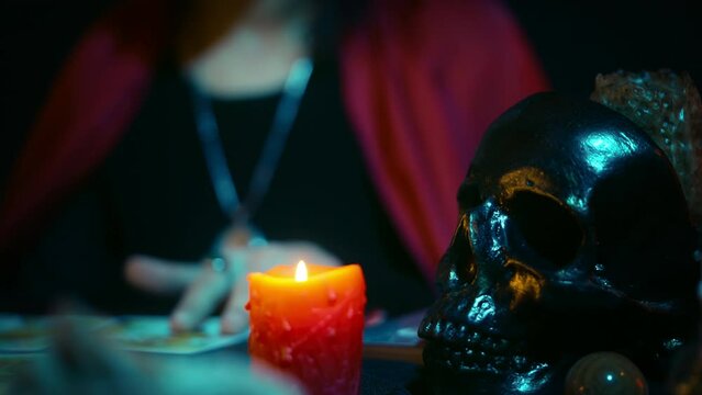 Psychic reading tarot in mystical setting, giving advice, spiritual consultation