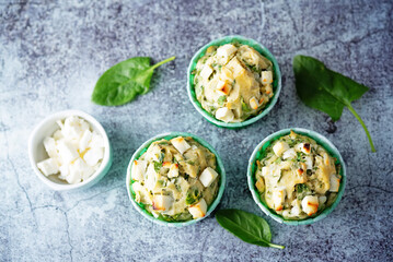 Spinach Feta cheese breakfast muffins with fresh spinach leaves