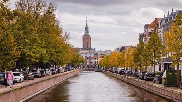Day Time Lapse of canal in autumn scene in Den Haag with Grote of Sint-Jacobskerk, Zuid-Holland, The Netherlands