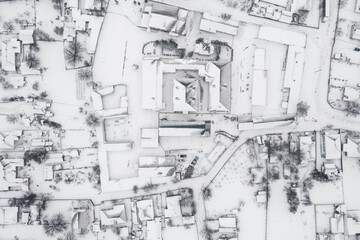 Snow-covered village, view from above. houses covered with snow, severe northern frosts