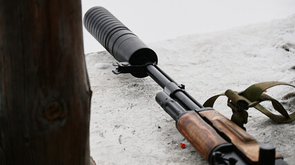 Silencer on Kalashnikov assault rifle in retro style