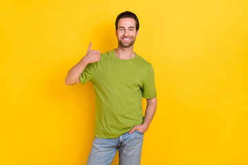 Photo of cool beard young guy show thumb up wear t-shirt jeans isolated on yellow color background