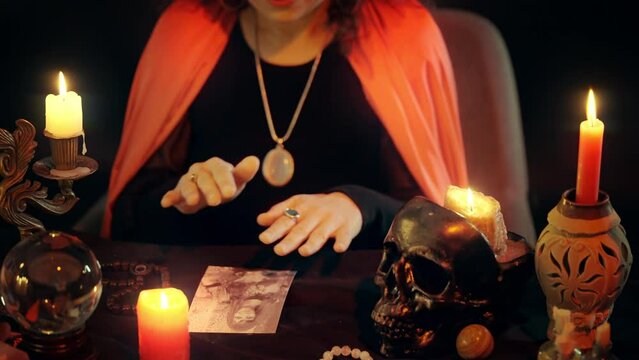 Psychic using photo to put an evil eye on person, psychic powers, black magic