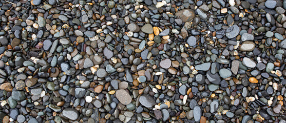 Smooth round pebbles texture background.