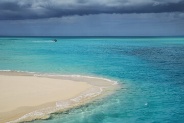 Fototapeta na wymiar Sandy beach at the tip of Mouli Island in Ouvea lagoon, Loyalty Islands, New Caledonia.
