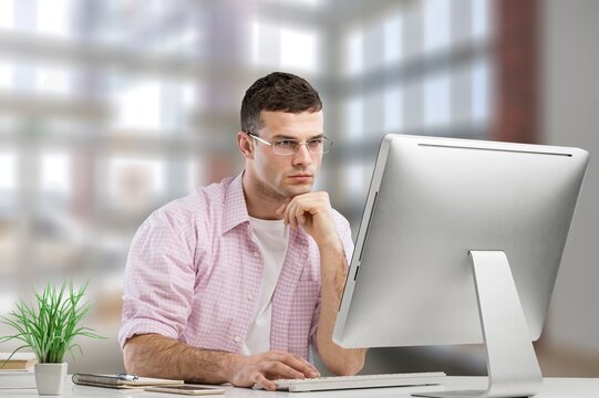 Young Student has an Online Video Lecture Uses a computer