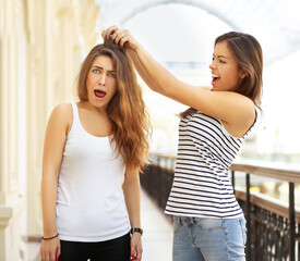 Fototapeta premium Lifestyle portrait of two beautiful best friends girl having great time.