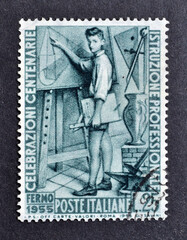 Cancelled postage stamp printed by Italy, that shows Student in front of board, Centenary of...