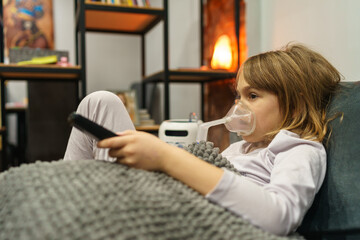 Shot of a sad girl sitting on a couch and taking his respiratory therapy.