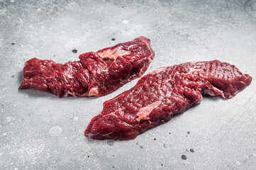 Machete steak raw cut or hanging tender cut. Gray background. Top view