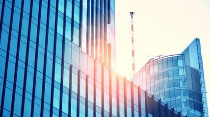Fragments of building in business district of modern city. High-rise office building in downtown. Modern architecture of typical concrete, glass and steel. Cross process photo filter.