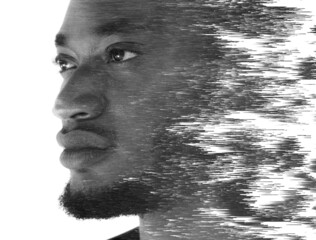 A double exposure portrait of an attractive man combined with digital art.