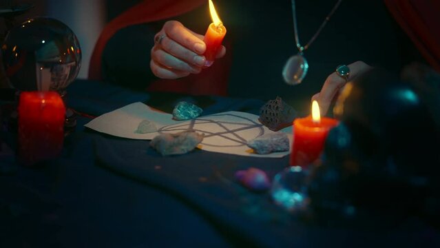 Witch performing occult rite with pentagram, satanic rituals, black magic