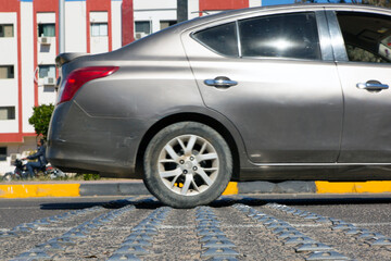 The car passes an artificial roughness on the road, focus on the roughness