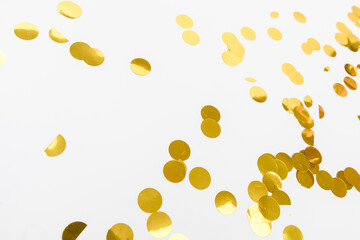 golden confetti on white background flat lay text place .