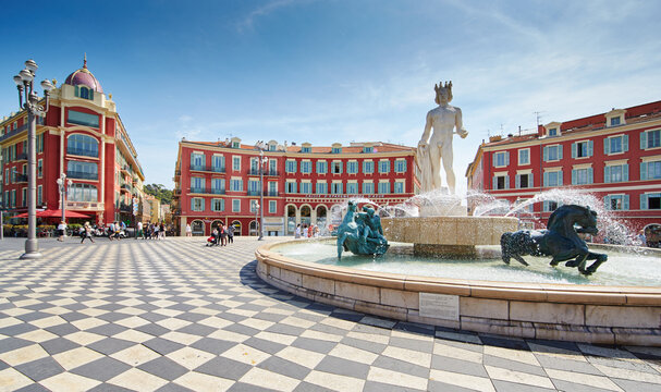 France, Nice, Fountain of the Sun, Place Massena in center of Nice, Plassa Carlou Aubert, tourism, sunny day, blue sky, square tiles laid out in a checkerboard pattern, Apollo statue