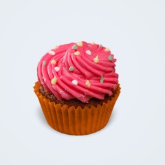 Chocolate cupcake decorated with icing and sprinkles