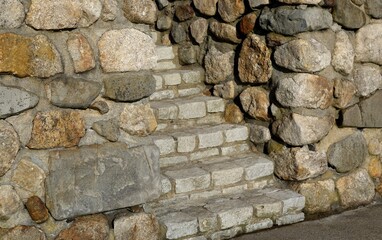 close view of stone stairs within a stone wall - 488863099