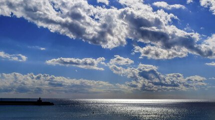 dramatic clouds over the Mediterranean sea in Calpe, Spain. Four elements: sky, clouds, water and...