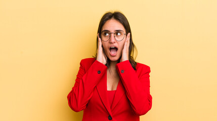 young hispanic woman feeling happy, excited and surprised. business concept