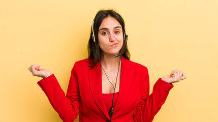 young hispanic woman feeling puzzled and confused and doubting. telemarketer concept