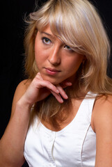 Naklejka premium Young pretty woman over black background