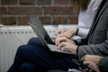 Press conference, man, businessman, typing on a laptop