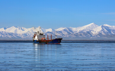 Winter landscape with a sea vessel