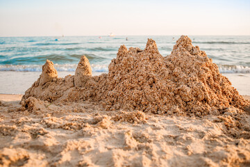 Sand castle on a sandy sea beach