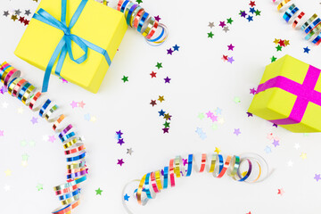 Colorful confetti and presents on white  background text place.