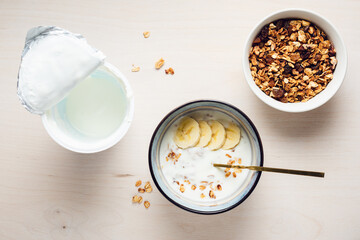 Granola with yogurt and bananas.