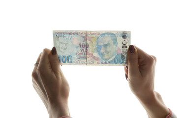 Woman checking Turkish lira banknote against light. Fake money concept. - obrazy, fototapety, plakaty