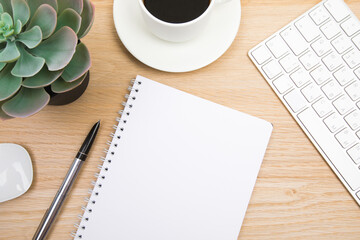 open notepad, cup of coffee, pen ,moose, keyboard on wooden background spiral notebook on table Business, planning, education, morning life working from home concept Top view Flat lay Mock up- Image