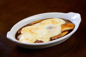 Sweet banana dessert. Fried banana with caramel sauce and melted cheese. Northeast of Brazil.