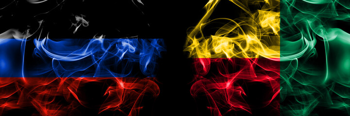 Donetsk People's Republic vs Benin, Beninese flag. Smoke flags placed side by side isolated on black background.