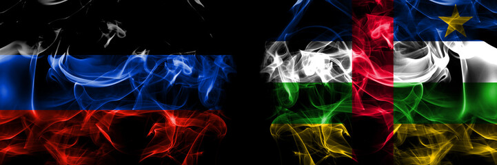 Donetsk People's Republic vs Central African Republic flag. Smoke flags placed side by side isolated on black background.