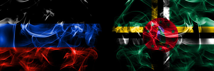 Donetsk People's Republic vs Dominica, Dominican flag. Smoke flags placed side by side isolated on black background.