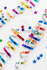 Obraz premium Colorful confetti on white background text place .