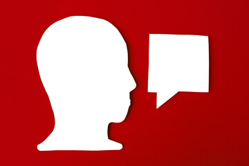  paper face and speech bubble on colorbackground copy space for text, communication, symbolic- Image