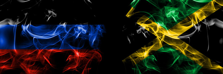 Donetsk People's Republic vs Jamaica, Jamaican flag. Smoke flags placed side by side isolated on black background.