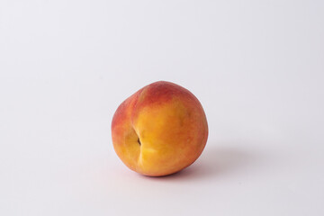 fresh peach on a white meza