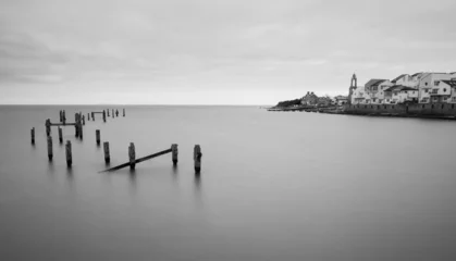 Fotobehang pier on the coast © Joseph