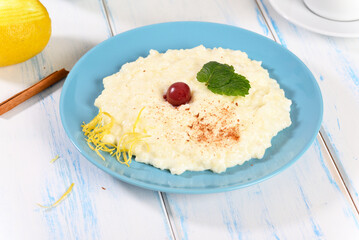 Rice milk porridge with fruit, healthy breakfast.