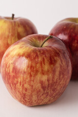 fresh red apples on a white table