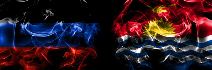 Donetsk People's Republic vs Kiribati flag. Smoke flags placed side by side isolated on black background.
