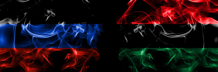 Donetsk People's Republic vs Organizations, Pan african, UNIA flag. Smoke flags placed side by side isolated on black background. - obrazy, fototapety, plakaty
