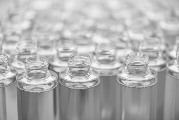 group of empty plastic bottles on the assembly line